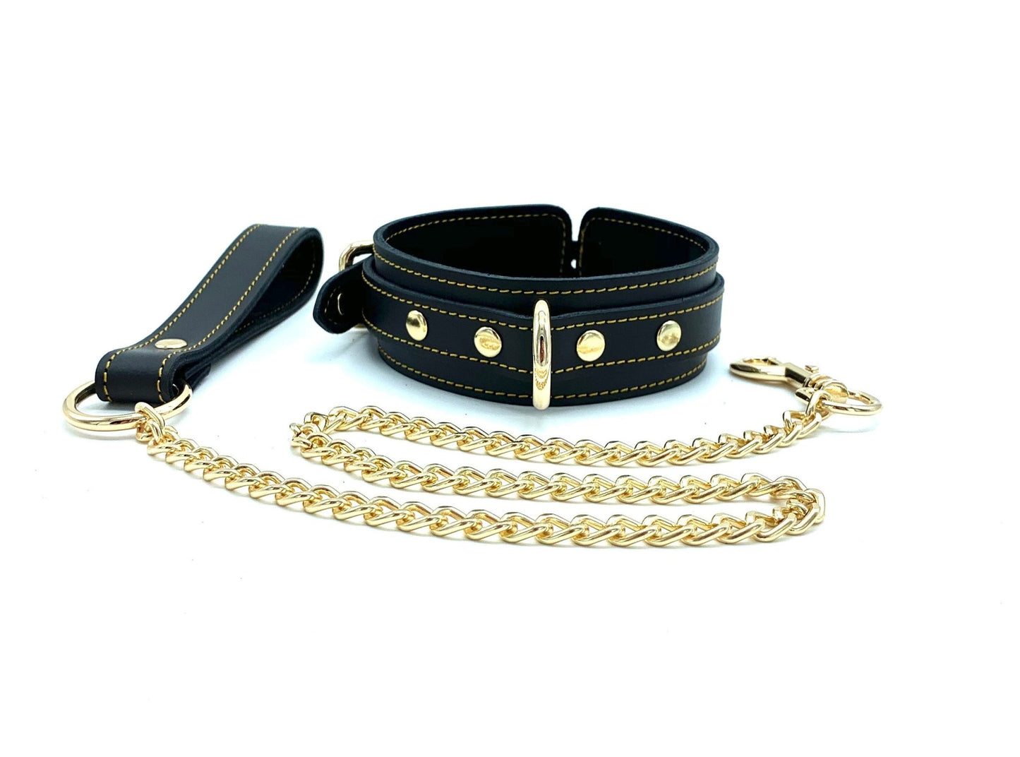 Black leather collar in the Tango Black BDSM Kit, equipped with a gold hardware detachable leash, showcasing exquisite Italian craftsmanship and high-quality BDSM accessories with gold stitching.