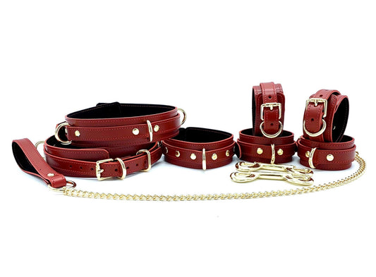 Tango Red BDSM Set featuring the complete luxury leather bondage kit, crafted from red leather and black suede with gold hardware. Includes two durable metal connectors, ideal for sophisticated BDSM leather gear made in the USA, Collar and Chain Leash, Hand and Ankle Cuffs, 
