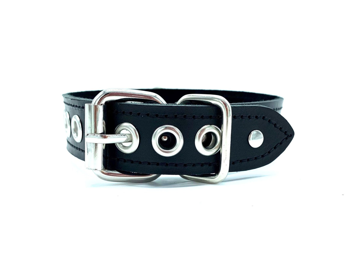 Close up of the buckle closure with metal eyelets in the adjusting holes