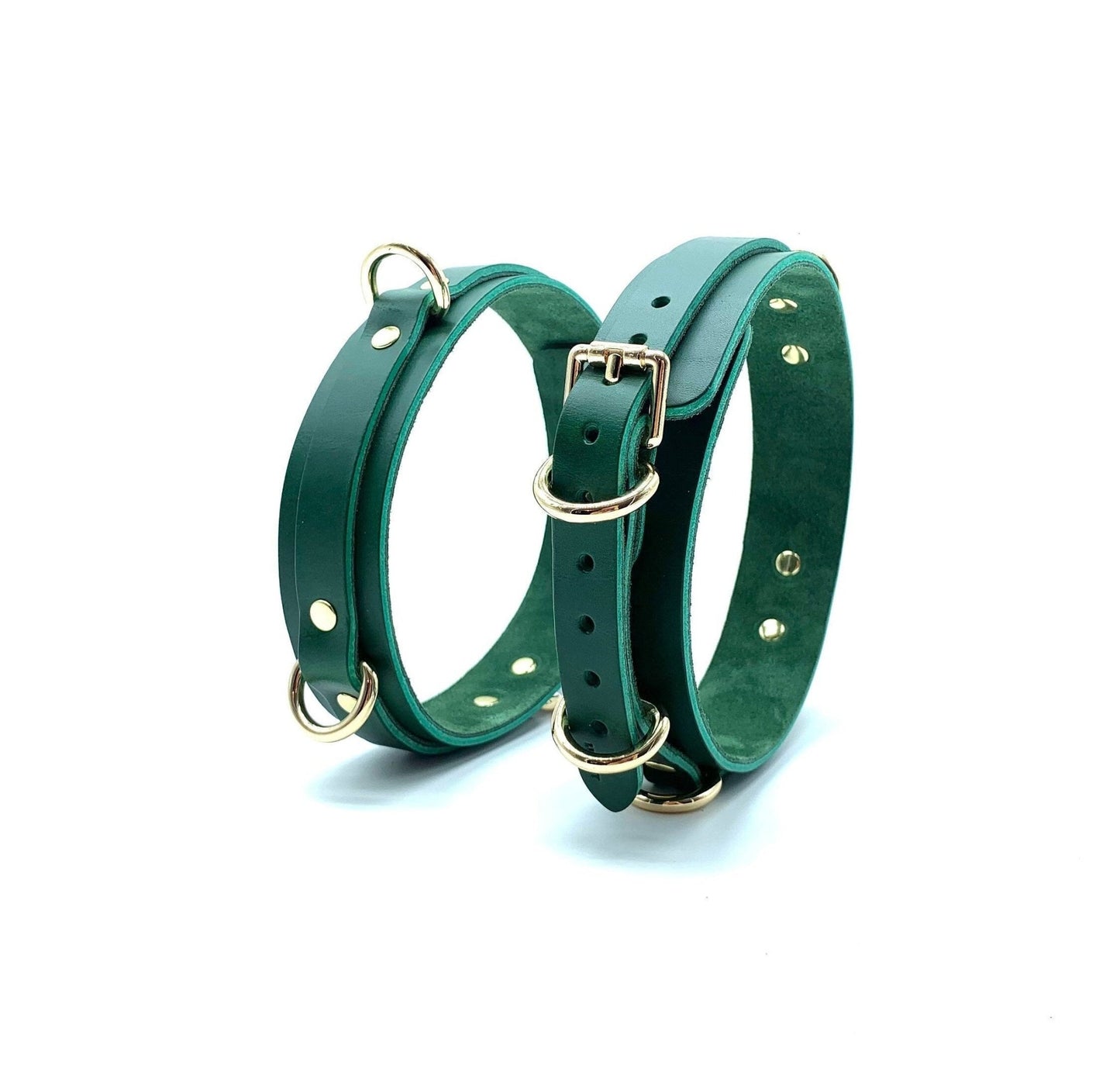 Mona Green luxurious Italian leather BDSM bondage thigh cuffs standing upright, displaying their structured form and vibrant green hue, reflecting the high-quality Italian craftsmanship.