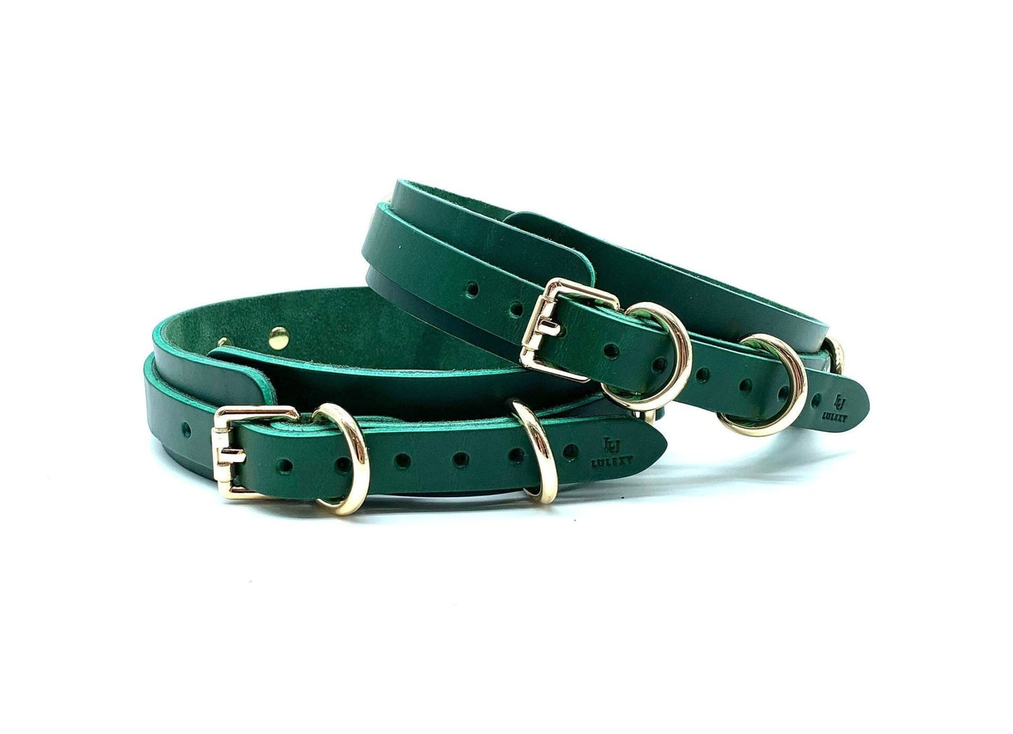 Lulexy : Back view of the luxurious Mona Green Italian leather BDSM bondage thigh cuffs, focusing on the intricate gold buckles that secure the cuffs, showcasing the fine craftsmanship and rich green leather.