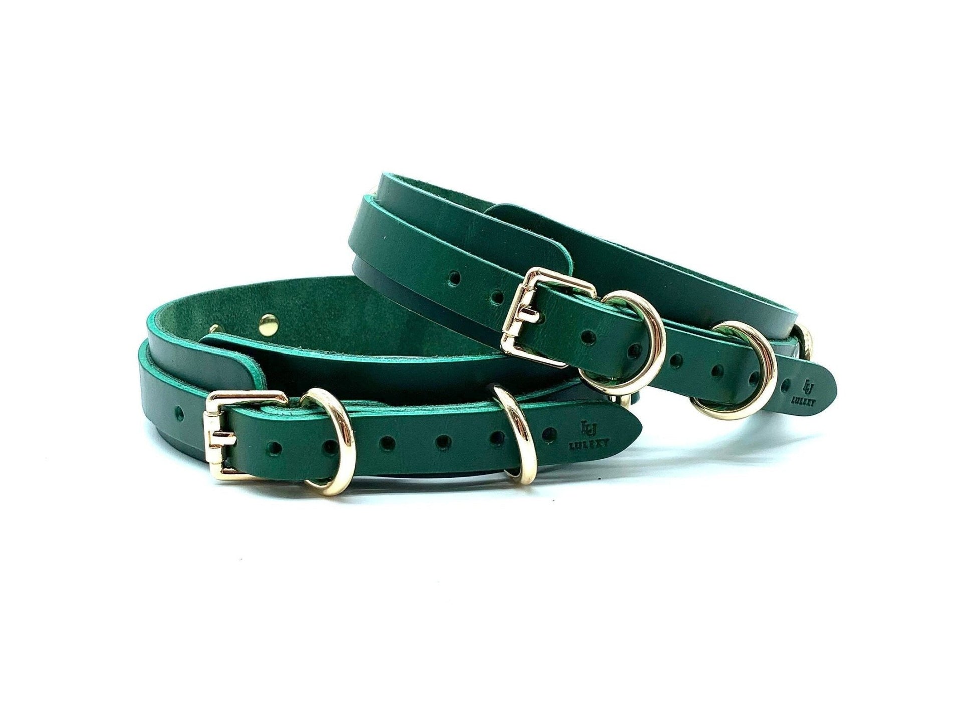 Lulexy : Back view of the luxurious Mona Green Italian leather BDSM bondage thigh cuffs, focusing on the intricate gold buckles that secure the cuffs, showcasing the fine craftsmanship and rich green leather.