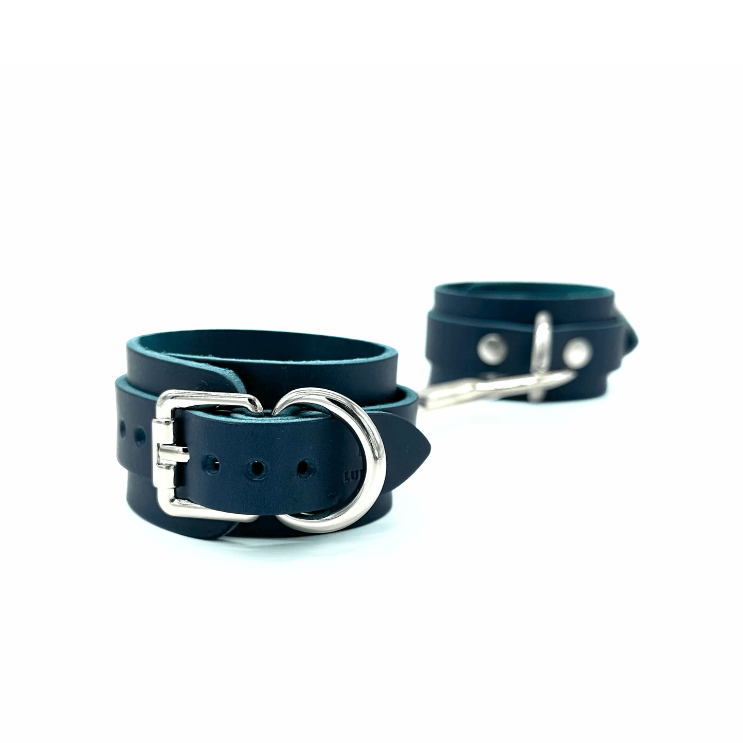Blue leather handcuffs with silver hardware, adjustable cuffs with buckle closure and clean finish