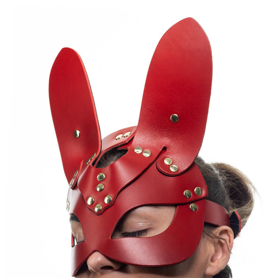 Lulexy red bunny mask, crafted from premium Italian leather and lined with matching red suede. The mask features elongated bunny ears and high-quality hardware, exuding a playful yet luxurious aura in a vibrant red hue.
