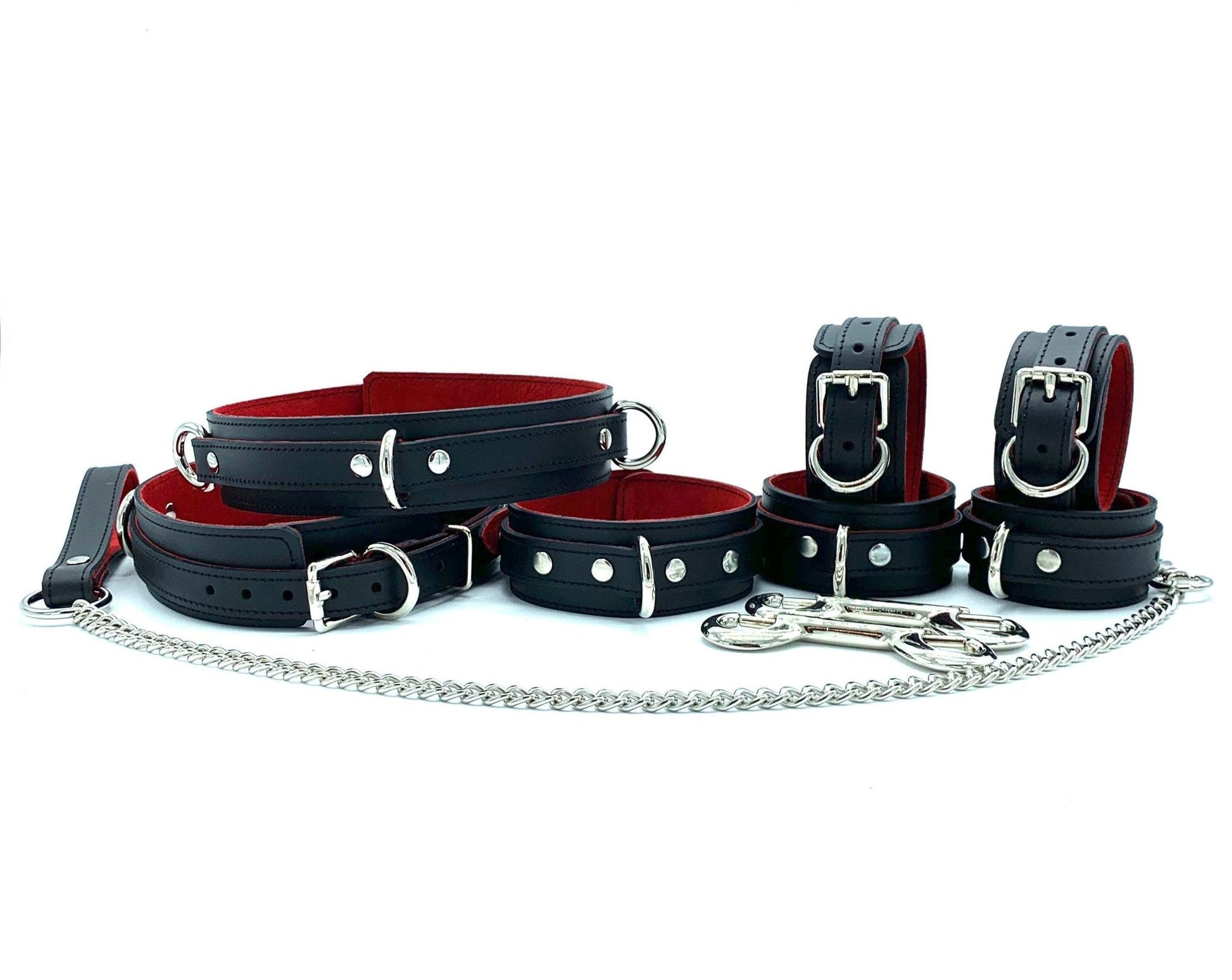 As a Set of 7 Pieces: A collection of seven Scarlet Italian leather BDSM bondage thigh cuffs, arranged to demonstrate their uniform scarlet color and consistent craftsmanship, all made from Italian leather in the USA.