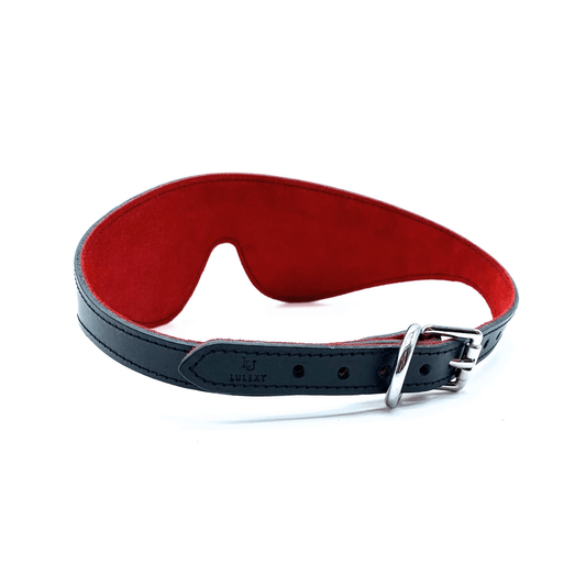 Black leather blindfold with red suede lining and silver buckle, adjustable strap and soft interior