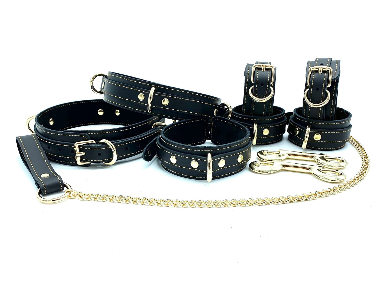 Complete set of seven Italian leather and suede BDSM bondage pieces made in the USA, including Tango black cuffs with gold stitching, providing a comprehensive collection of premium-quality bondage accessories for discerning users.