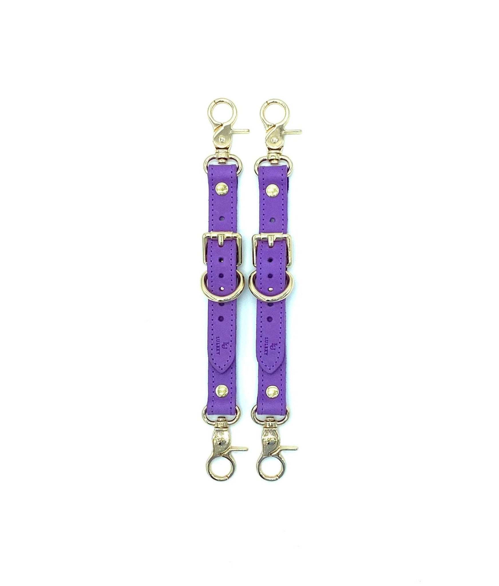 Rich Tango Purple Italian leather garters designed by Lulexy in the USA, featuring a smooth Italian suede interior. The deep purple leather is paired with sturdy, nickel-plated hardware for a luxurious BDSM experience.