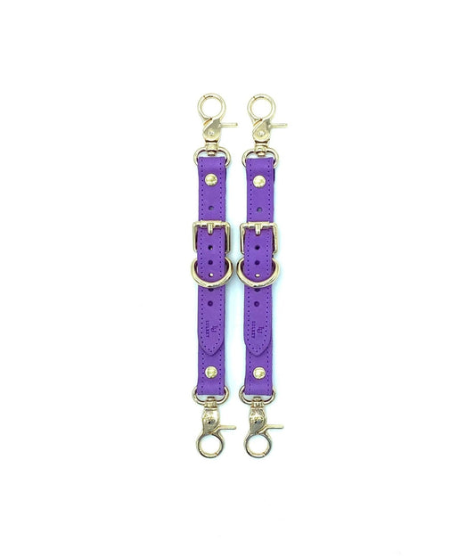 Rich Tango Purple Italian leather garters designed by Lulexy in the USA, featuring a smooth Italian suede interior. The deep purple leather is paired with sturdy, nickel-plated hardware for a luxurious BDSM experience.