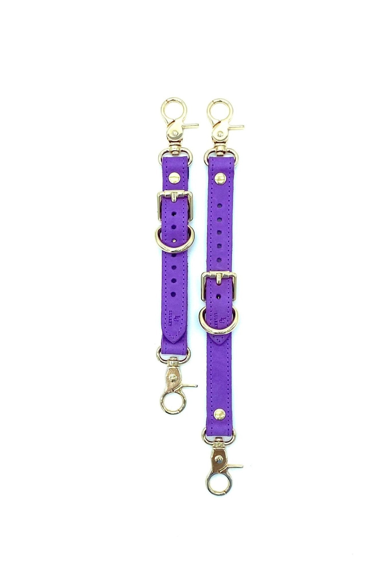 Rich Tango Purple Italian leather garters designed by Lulexy in the USA, featuring a smooth Italian suede interior. The deep purple leather is paired with sturdy, nickel-plated hardware for a luxurious BDSM experience.