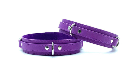 Front View: Front view of Tango Purple Italian leather BDSM bondage thigh cuffs, featuring a rich purple hue, crafted with premium Italian leather made in the USA.