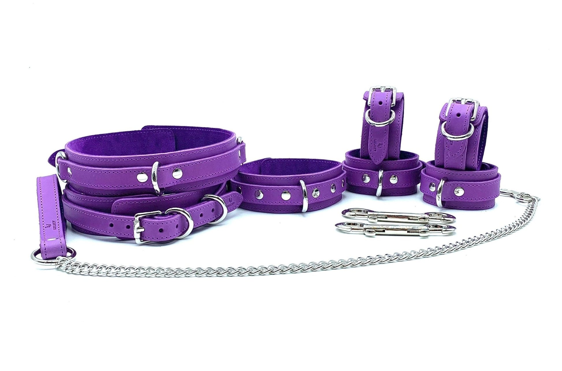Set View: An arrangement of Tango Purple Italian leather BDSM bondage thigh cuffs, displaying a complete set with consistent design and color, all crafted from Italian leather in the USA.