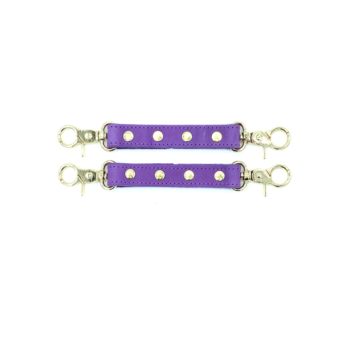 Purple leather 2 two-way connectors with gold hardware on a white background