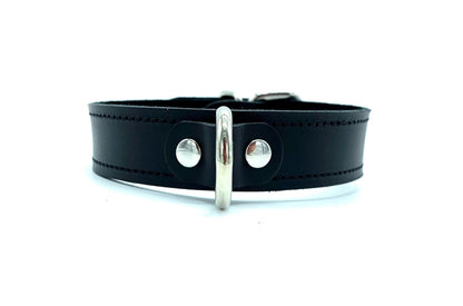 Black Italian leather day collar 1" wide. It ha black stitching and metal D ring in the center
