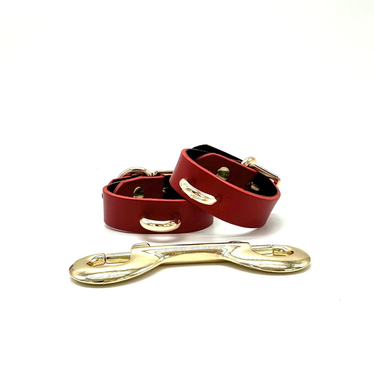 Slim Red leather Rio cuffs with gold D ring and double end snap hook connector