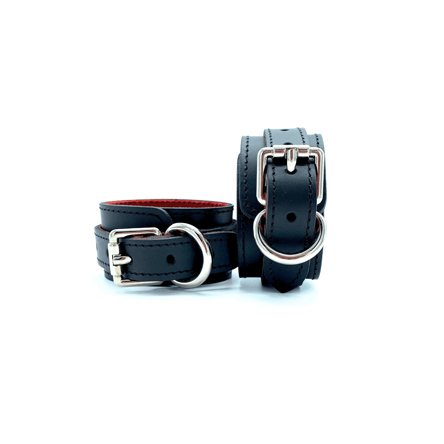 Black leather handcuffs 1.5 inch wide, red suede lining and silver buckles.