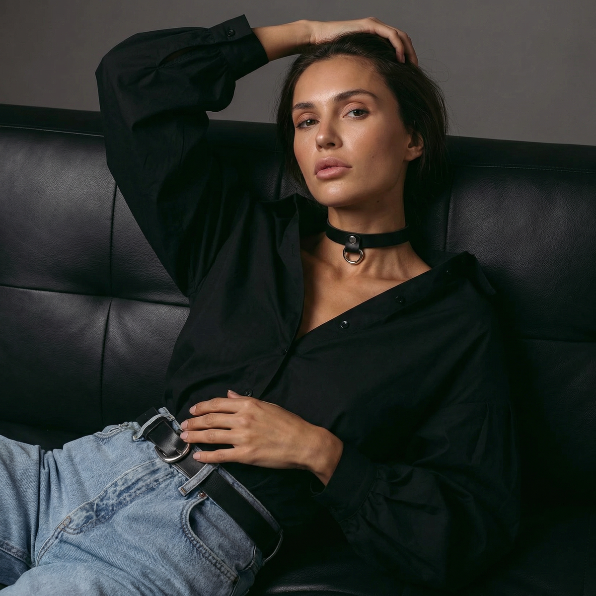 Model wearing a black 0.75-inch Italian leather choker with silver D-ring hardware, styled with a black blouse and jeans.