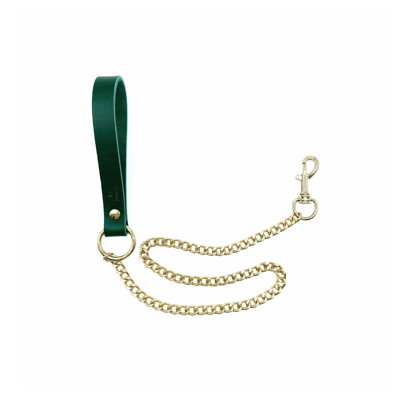 gold chain detachable leash with snap hook and green leather handle. 