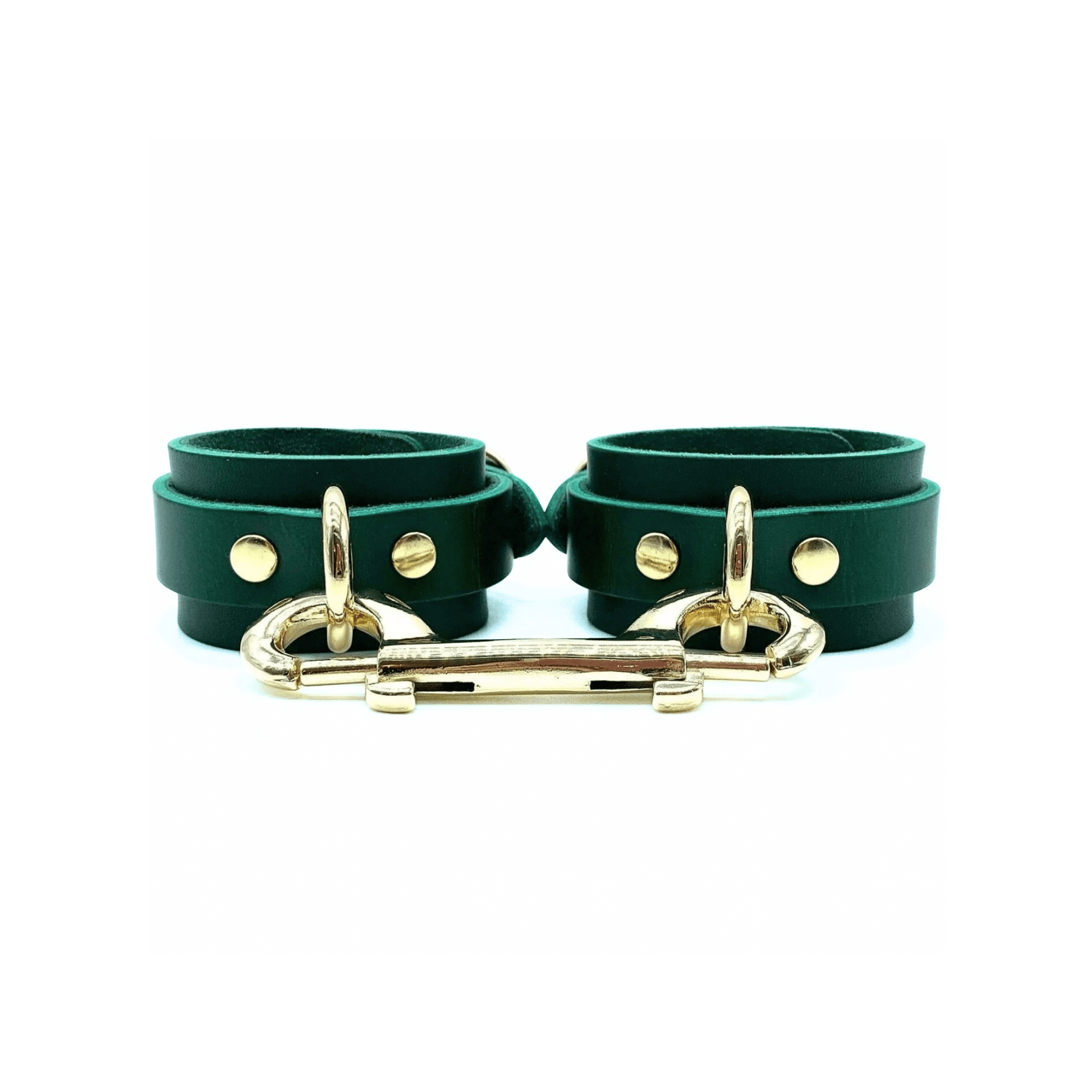 green leather handcuffs with center gold D-ring and double ended snap hook connector.