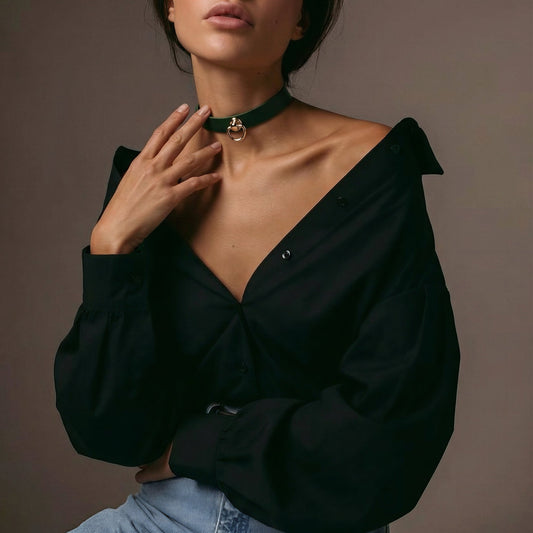 Model wearing Italian leather choker with gold D-ring, minimalist collar styled on black outfit