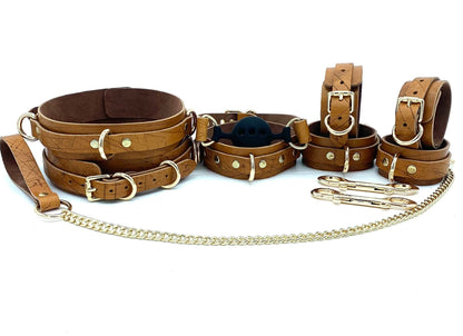 Set of 7 Pieces: A complete set of seven limited edition brown Italian leather thigh cuffs, arrayed neatly to display their uniform color and quality bronze buckles.