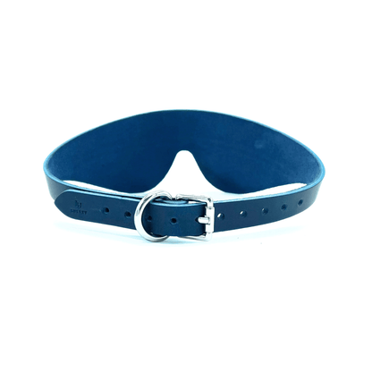 Blue leather blindfold side view with adjustable strap and buckle, smooth structured finish