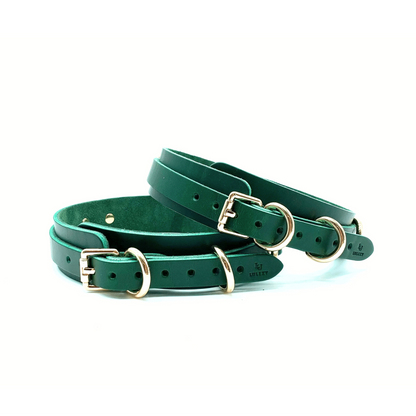 Green Italian leather thigh cuffs with gold hardware, adjustable straps with buckle closure