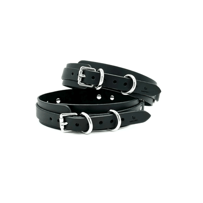 Black leather thigh cuffs with silver hardware, adjustable cuffs with buckle closure