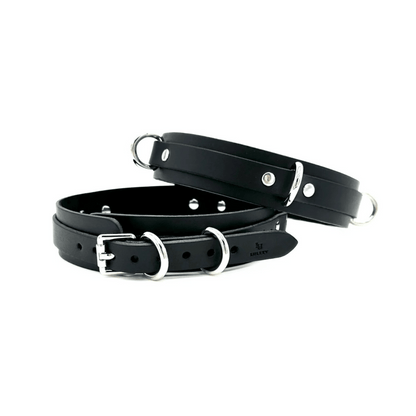 Black Italian leather thigh cuffs with silver hardware, paired adjustable cuffs with clean finish