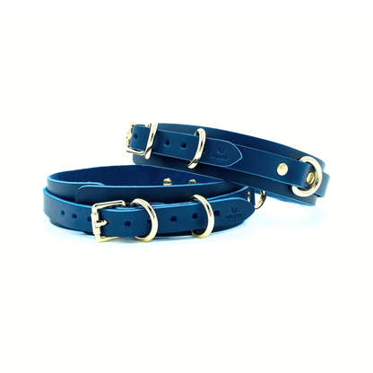 Blue Italian leather thigh cuffs with gold hardware, paired adjustable cuffs with buckle closure