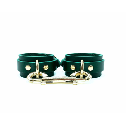 Green Buttero Italian leather handcuffs with gold hardware, adjustable cuffs with smooth finish