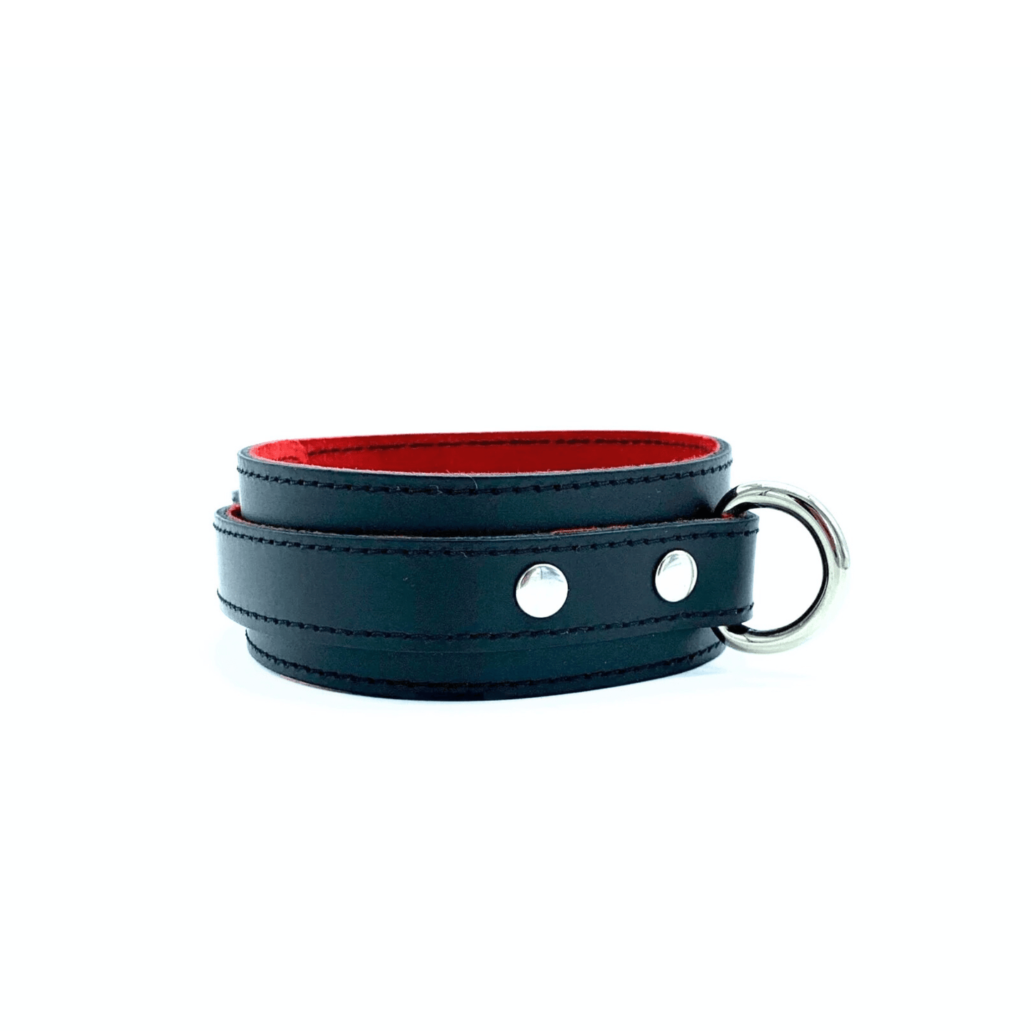 Side view of black leather collar from Scarlet collection with silver D ring and rivets on the side of the ring. 