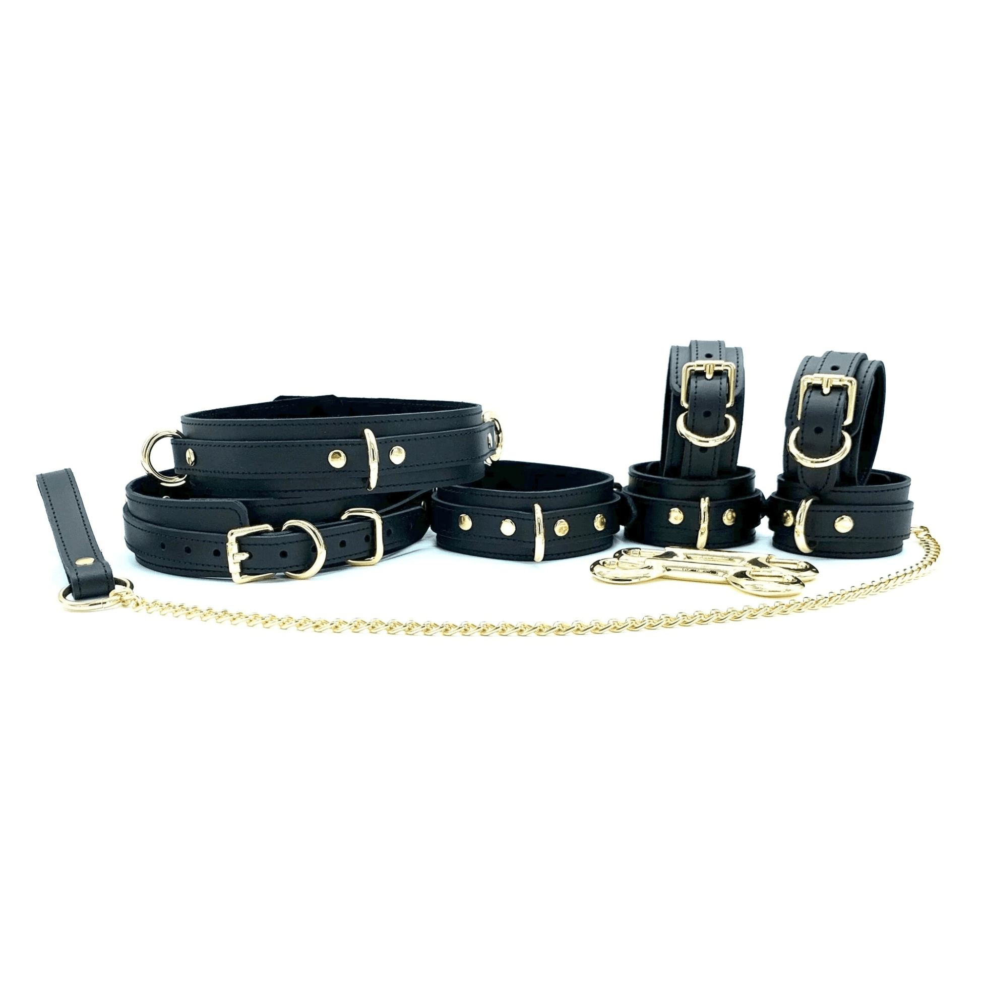 Black leather bondage set with gold hardware including collar, leash, wrist cuffs, ankle cuffs and connectors