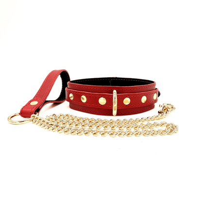 Red leather collar with gold hardware and matching chain leash.
