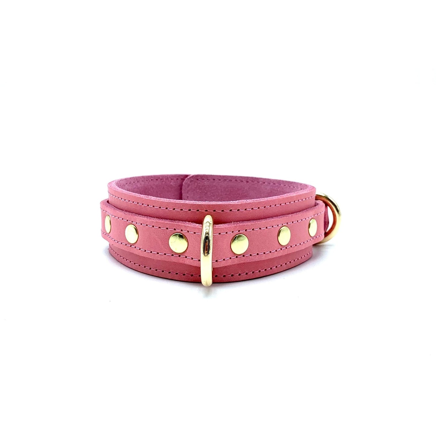 light pink leather collar showcasing detailed stitching, gold center D ring and rivets on each side of the ring.