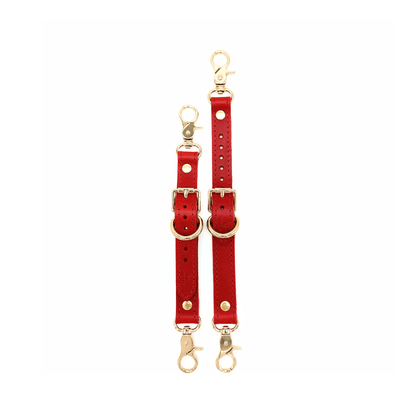 Red Italian leather garter straps with gold hardware, adjustable connectors with buckle detail