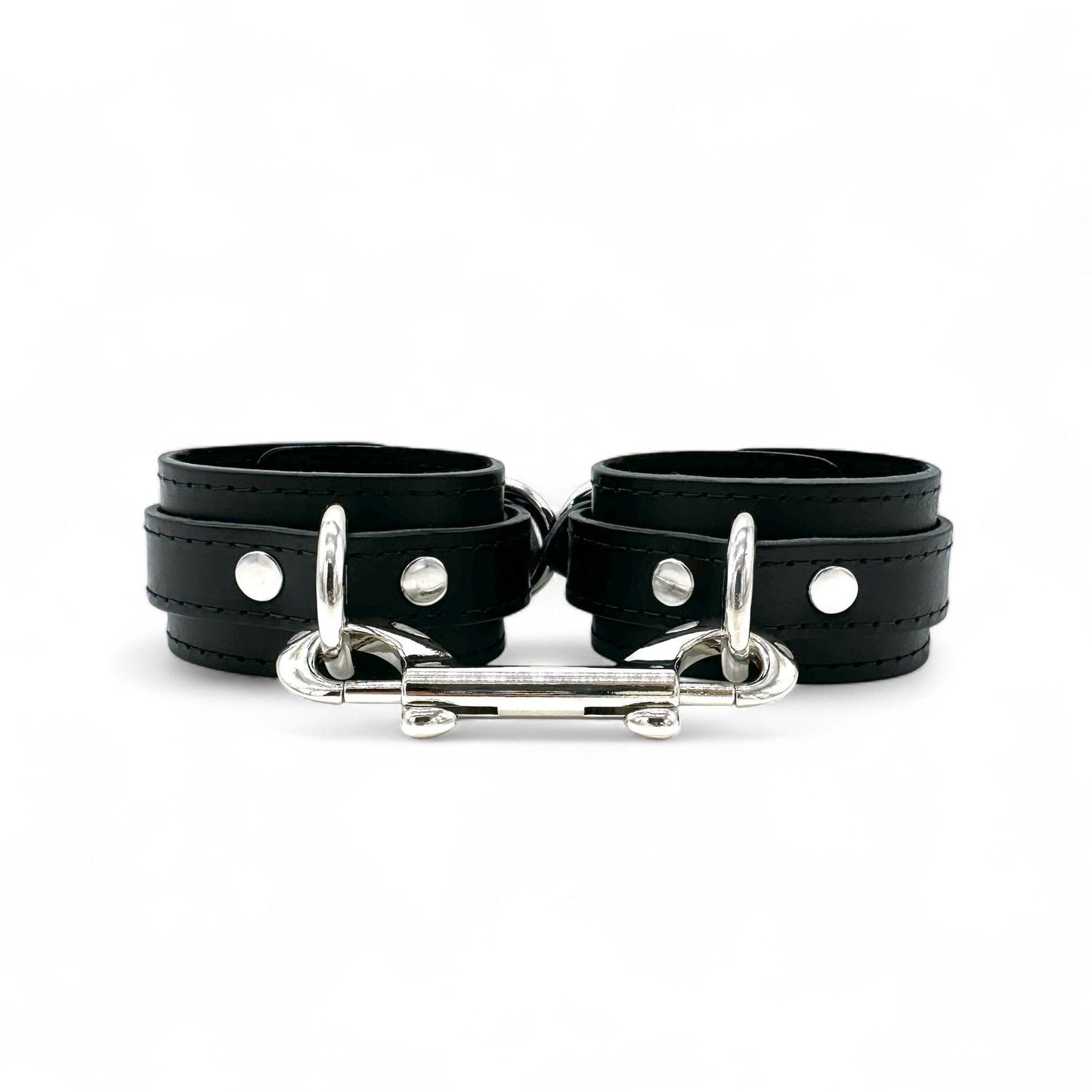 Black leather handcuffs with silver hardware, adjustable wrist cuffs with buckle closure handmade in USA