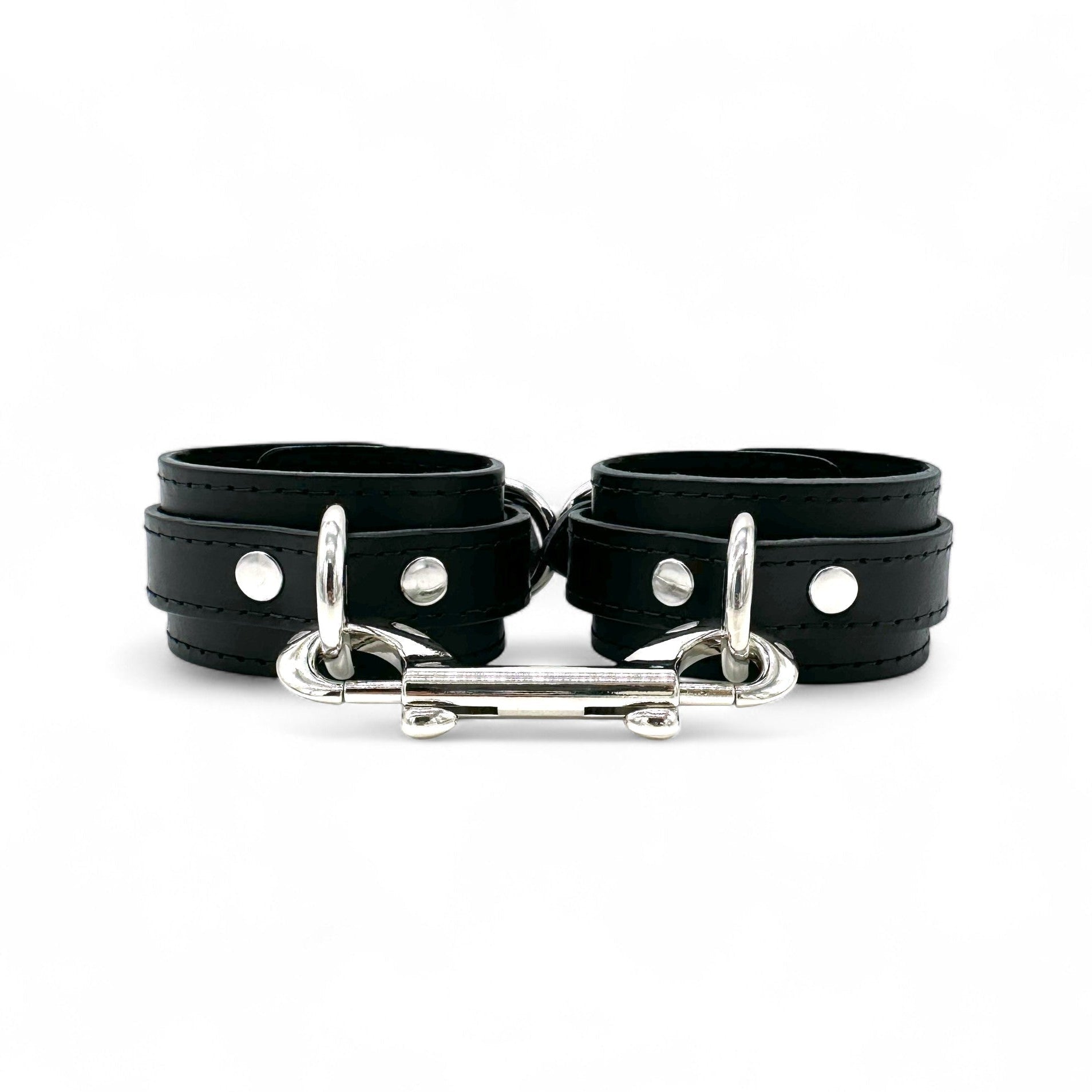 Black leather handcuffs with silver hardware, adjustable wrist cuffs with buckle closure handmade in USA