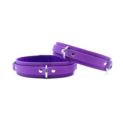Purple Italian leather thigh cuffs with multiple D rings for easy attachment points. 