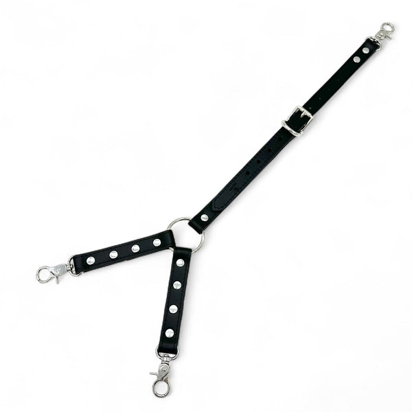 Black leather three way connector with silver center O ring and three snap hooks.