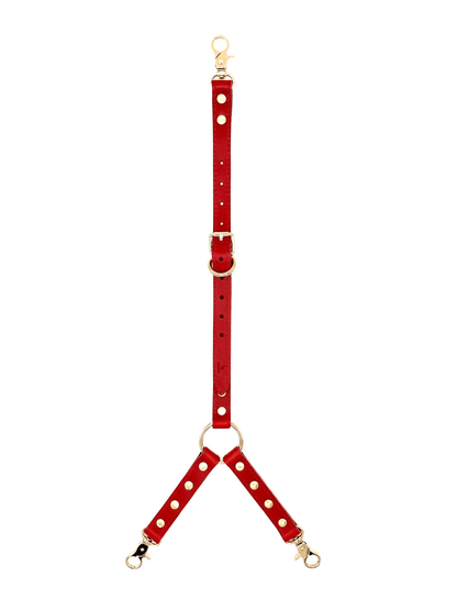 Red leather three way connector with gold hardware, adjustable straps and O-ring center with three clip ends