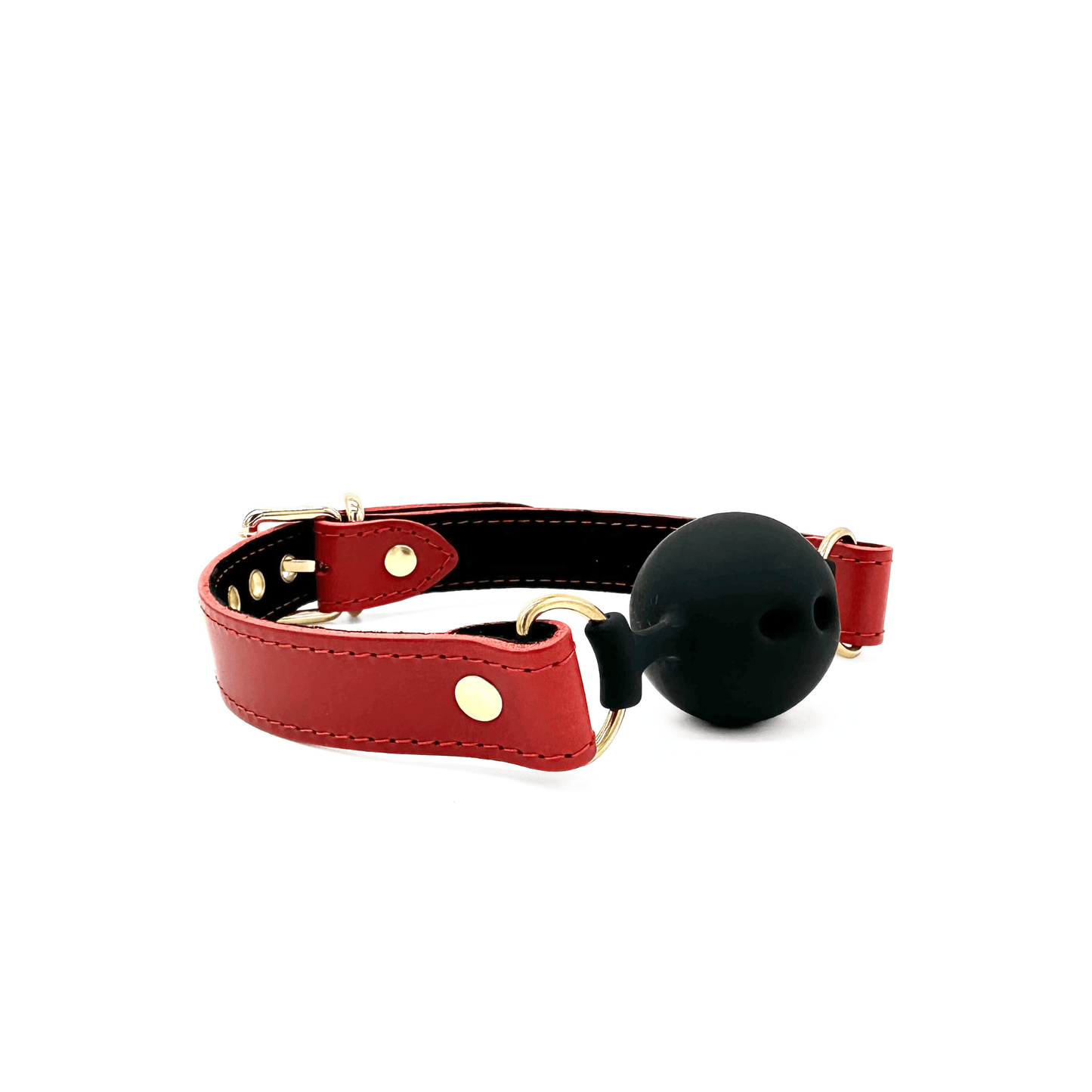 Side view of red leather ball gag with black silicone ball with 3 breathing holes and gold hardware.
