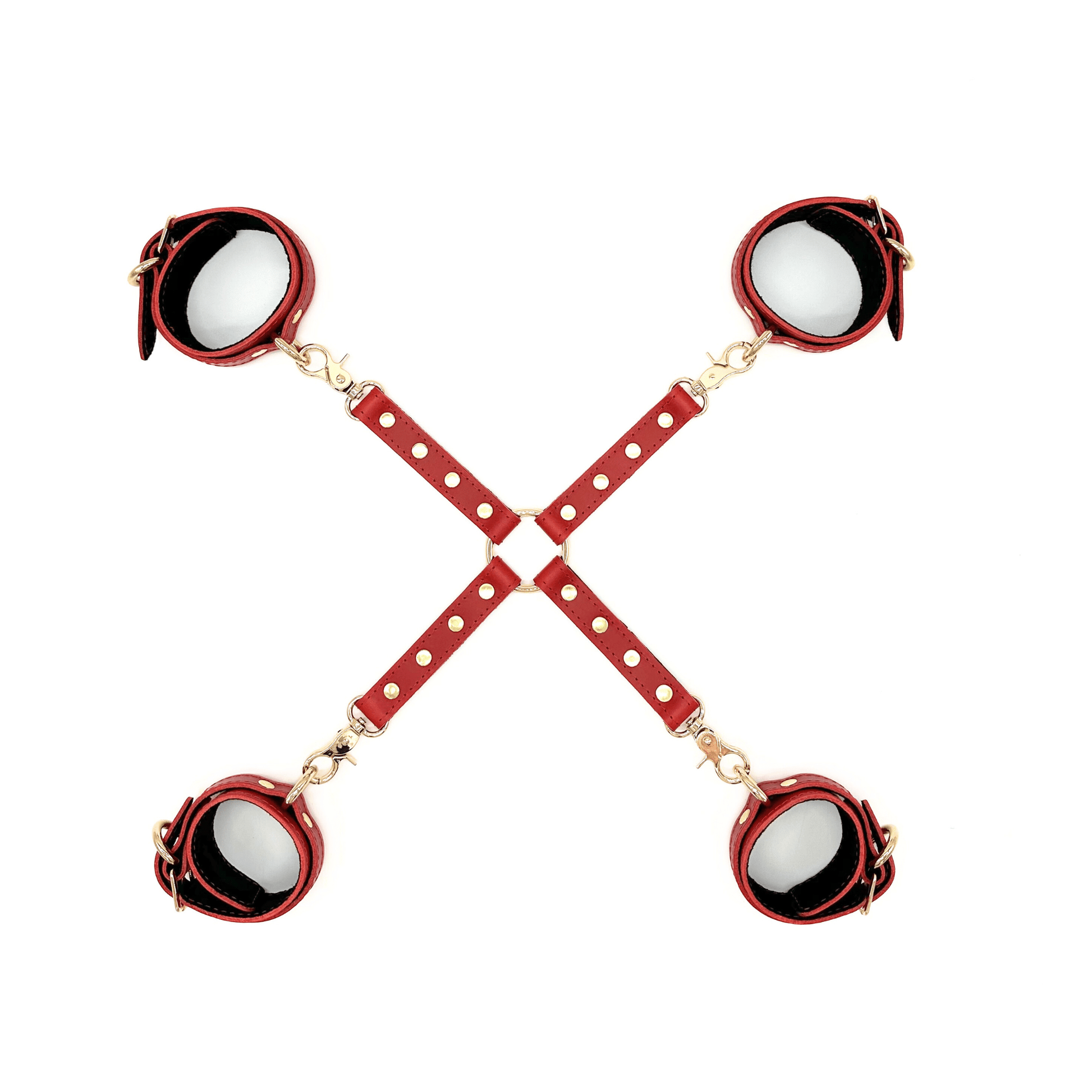 Red leather X restraint set with ankle and wrist cuffs, black suede lining and silver hardware on white background