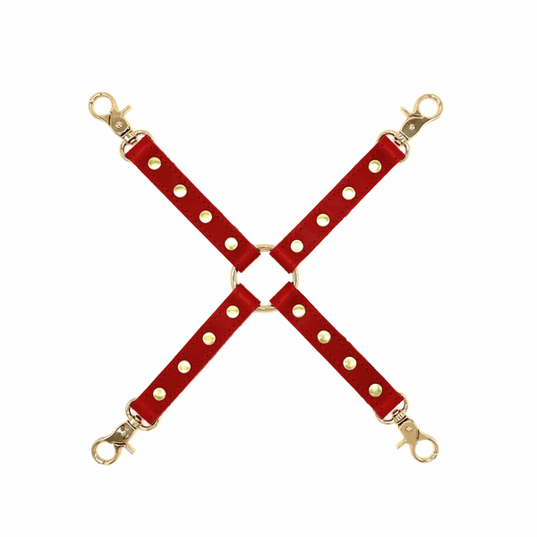 Red leather 4 way hogtie connector with gold hardware and center O-ring for bondage restraint system.