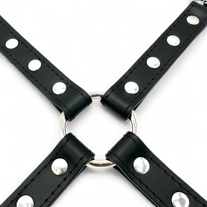 Close up image of black leather hogtie connector with stitched outline, silver rivets and central O-ring.
