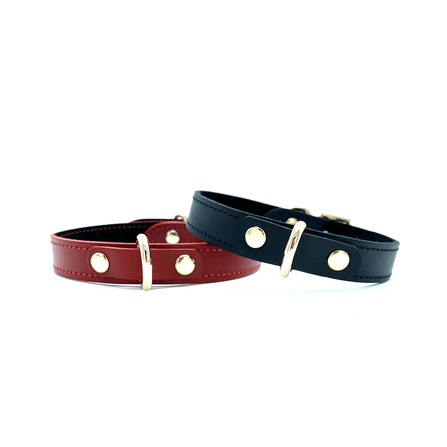 Red and black Italian leather collars with gold hardware, adjustable designs with smooth finish