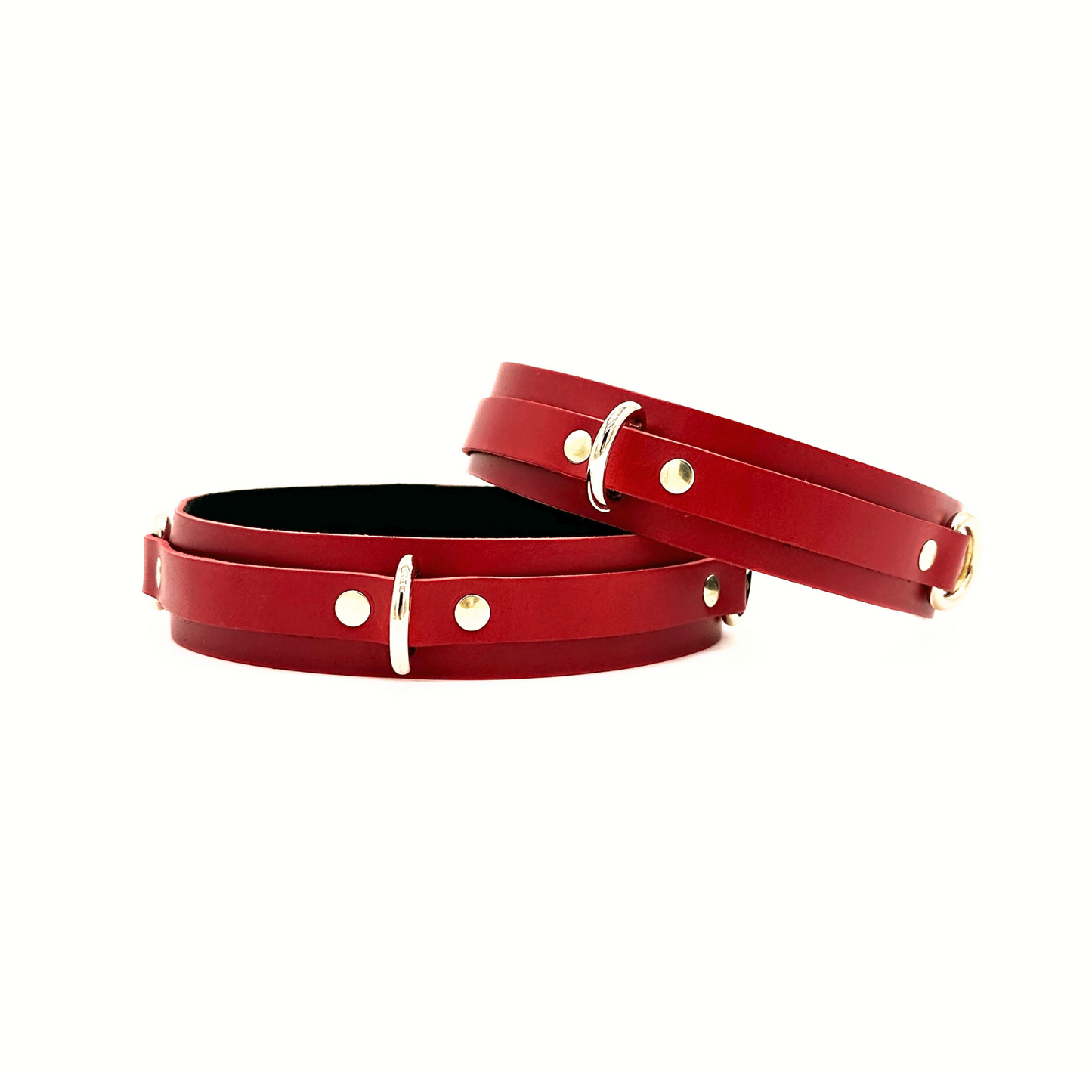 Red Italian leather thigh cuffs 1.5 inch wide with gold D rings to attach other restraints. 