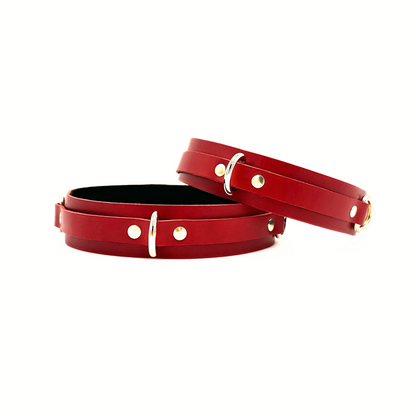 Red Italian leather thigh cuffs 1.5 inch wide with gold D rings to attach other restraints. 