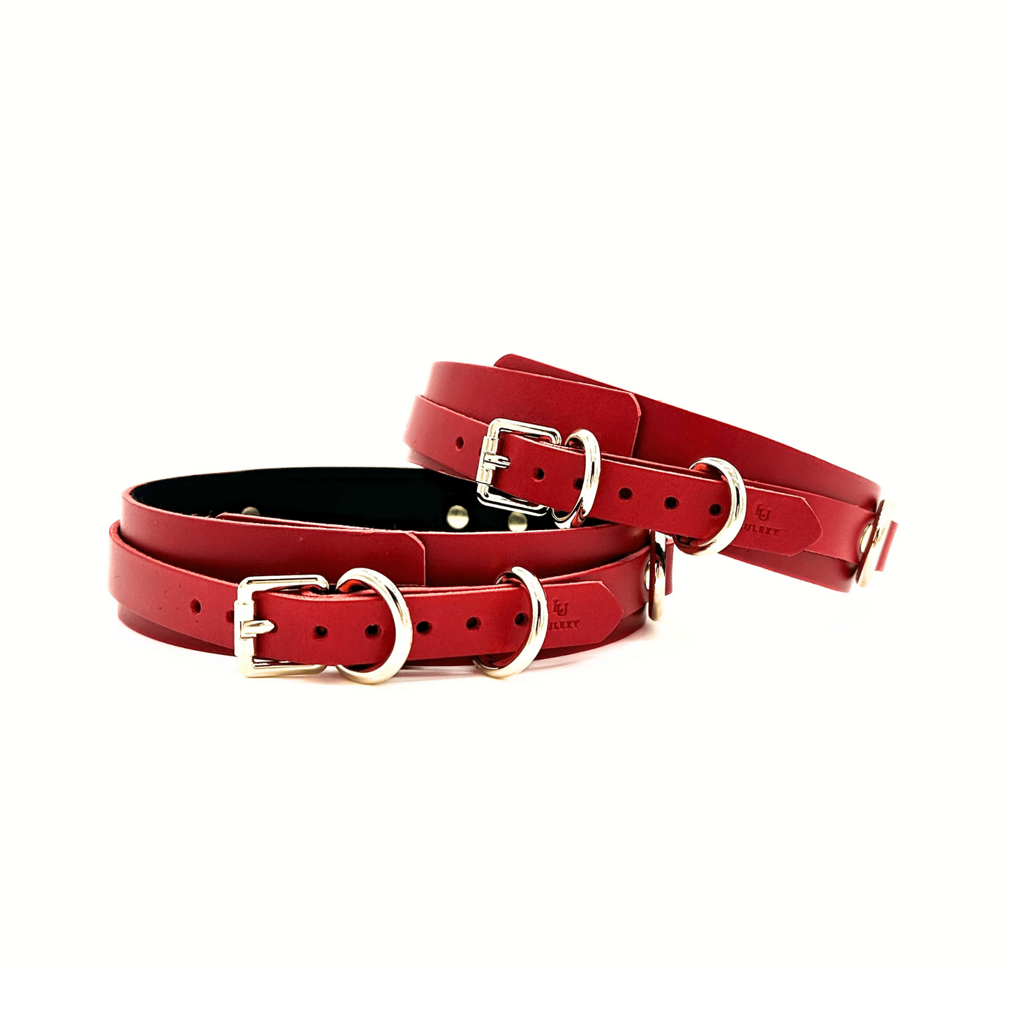 Red leather thigh cuffs showcasing elegant light gold buckles, multiple adjustment holes and Lulexy logo.