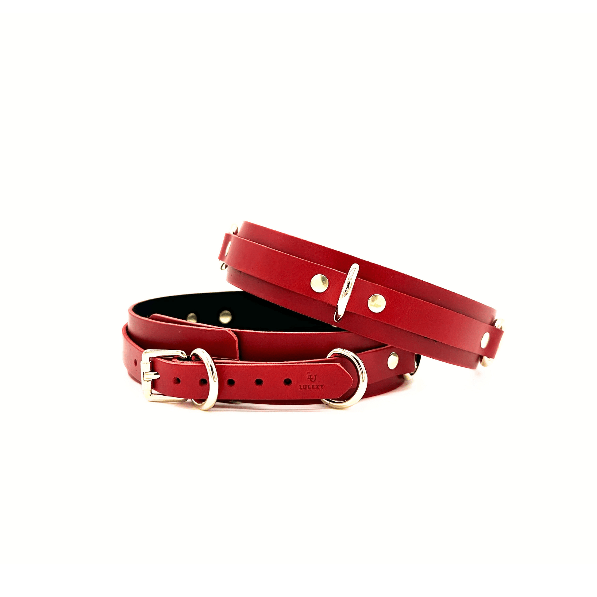 Red leather thigh cuffs with gold hardware and embossed Lulexy logo on white background.